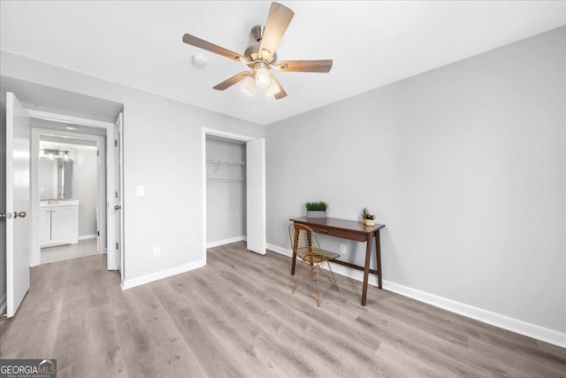 bedroom with ceiling fan, a closet, and light wood-type flooring