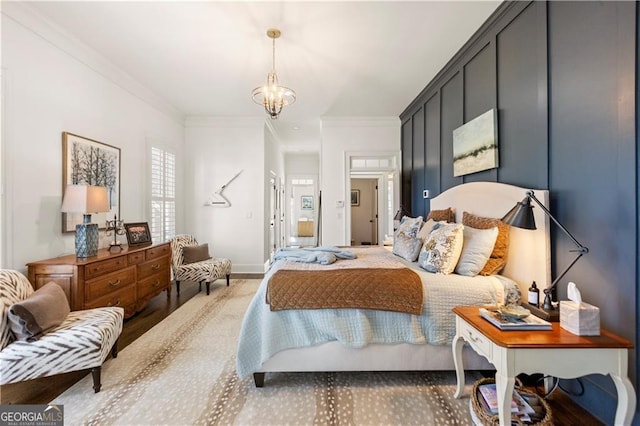 bedroom with ornamental molding and a notable chandelier