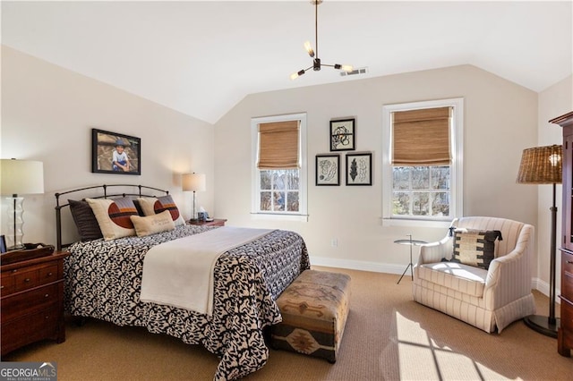 bedroom with light colored carpet and vaulted ceiling