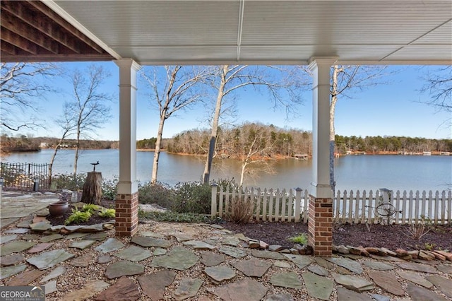 view of patio with a water view