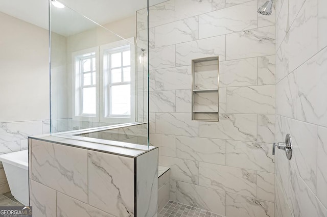 bathroom with tiled shower