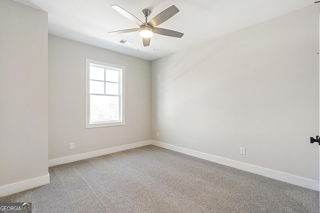 carpeted empty room with ceiling fan