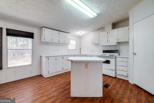 kitchen with white cabinets, a textured ceiling, white range with electric stovetop, and a center island