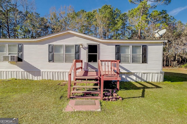 view of front of home with cooling unit and a front yard