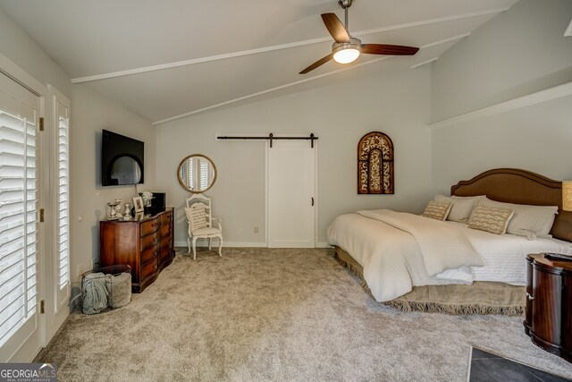 carpeted bedroom featuring ceiling fan, a barn door, and lofted ceiling