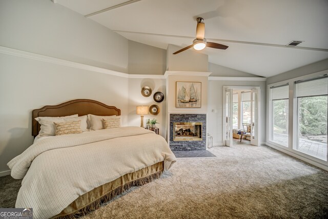 bedroom featuring vaulted ceiling, ceiling fan, access to exterior, a fireplace, and carpet floors