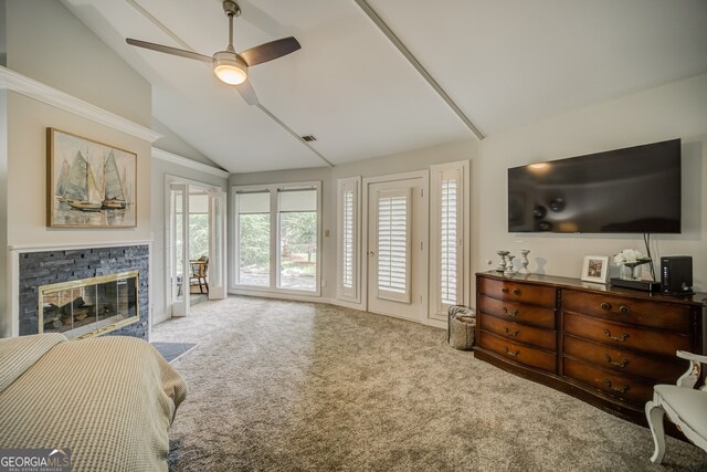 living room featuring ceiling fan, a stone fireplace, light colored carpet, and lofted ceiling