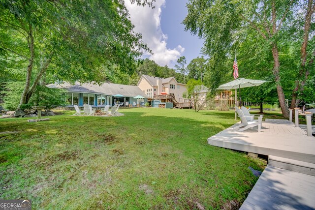 view of yard with a deck