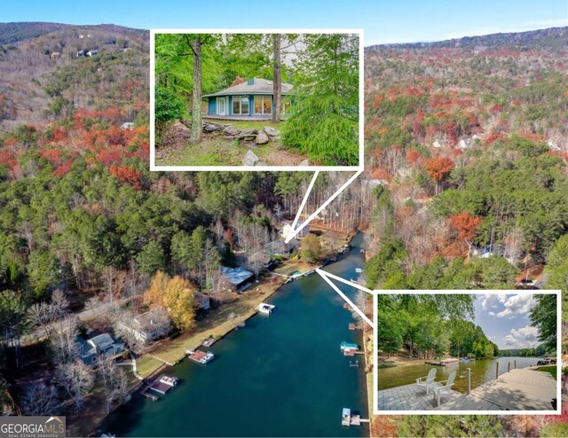 birds eye view of property featuring a water view