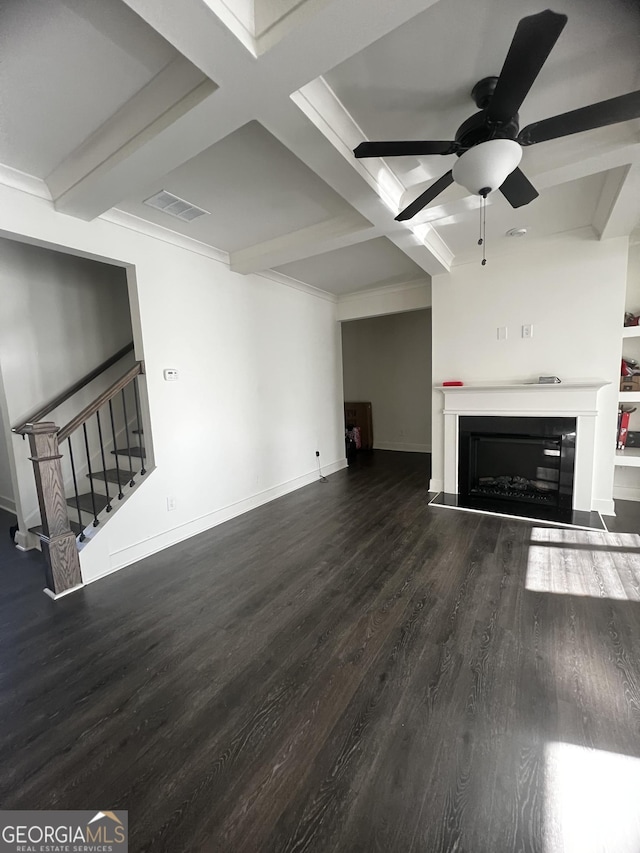 unfurnished living room with coffered ceiling, ceiling fan, beam ceiling, and dark hardwood / wood-style flooring