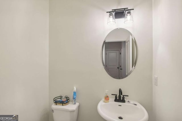 bathroom featuring sink and toilet