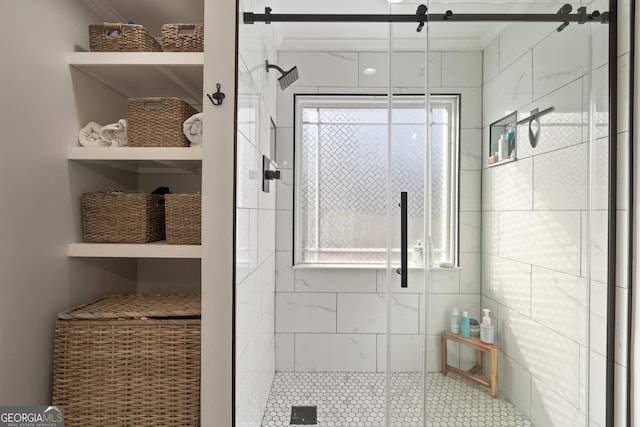 bathroom with a shower stall