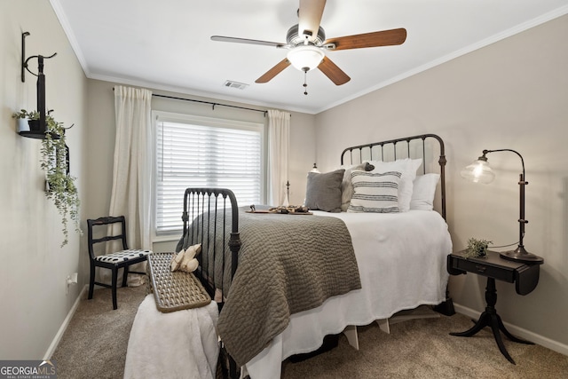 bedroom featuring baseboards, carpet, visible vents, and crown molding