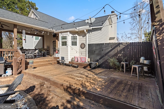 wooden terrace with fence and outdoor dining space