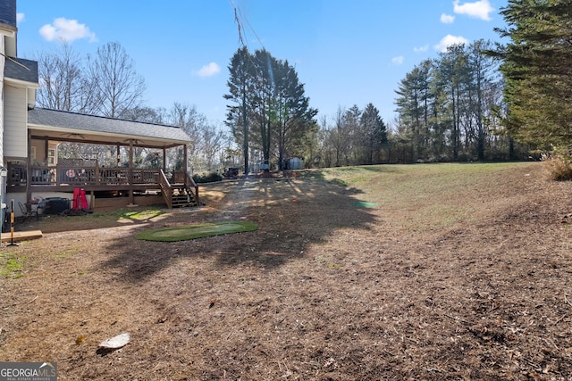 view of yard featuring a deck