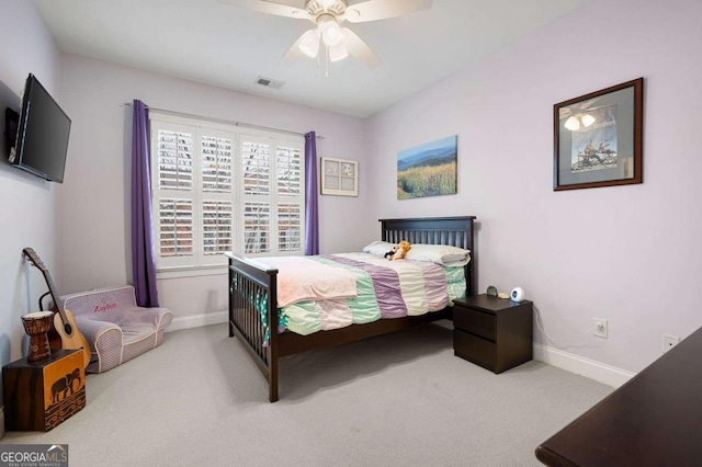 bedroom featuring ceiling fan and carpet