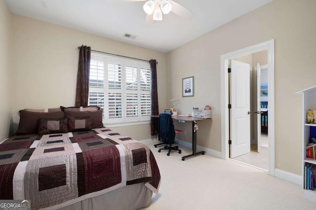 bedroom with light carpet and ceiling fan