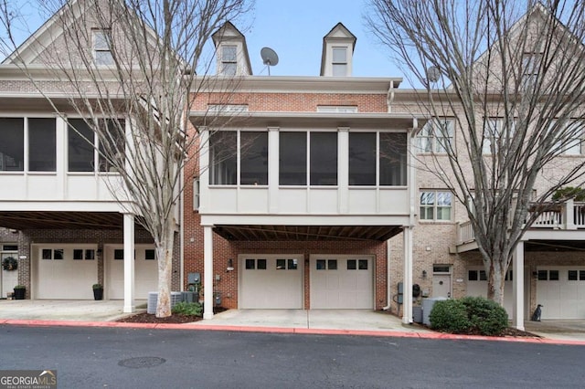 multi unit property featuring a garage