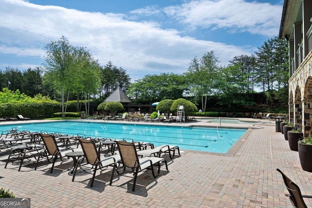 view of pool featuring a patio area