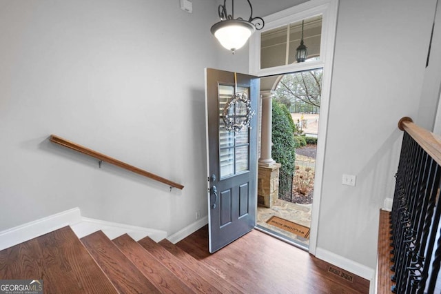 foyer entrance featuring wood-type flooring