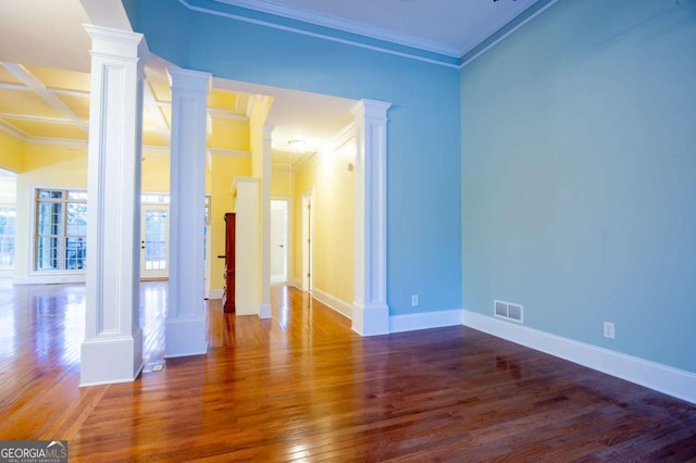 empty room featuring dark hardwood / wood-style flooring, beamed ceiling, coffered ceiling, and ornamental molding