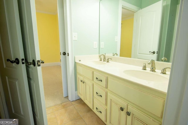 bathroom with tile patterned flooring, vanity, and ornamental molding