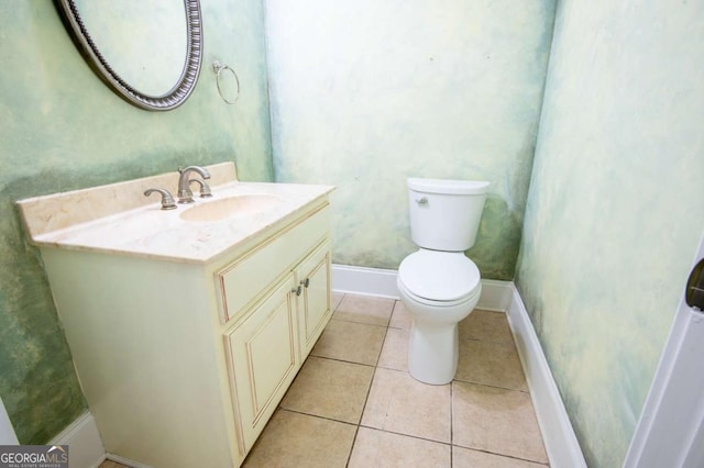 bathroom with tile patterned floors, vanity, and toilet