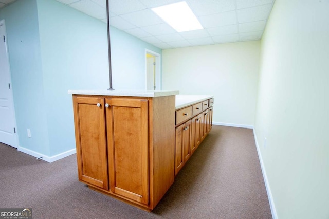 bar with carpet flooring and a drop ceiling