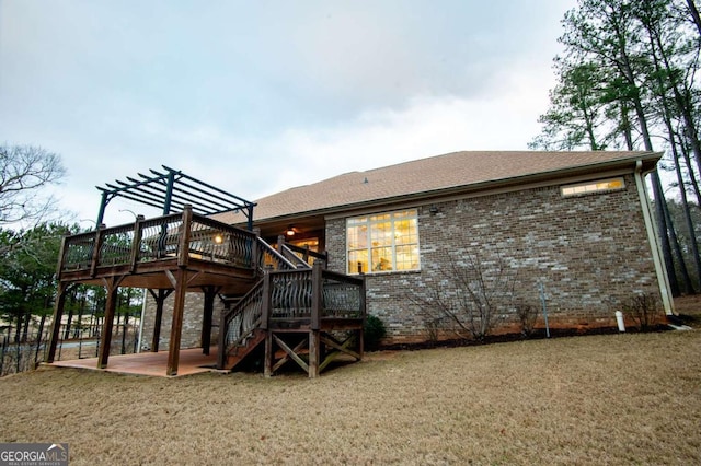 rear view of house featuring a pergola, a patio, and a wooden deck