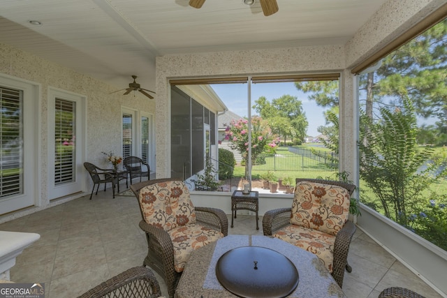 sunroom / solarium with ceiling fan