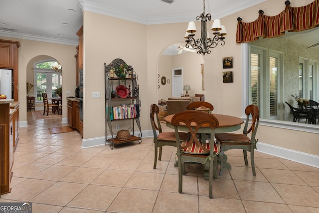 dining room with crown molding, french doors, light tile patterned floors, and a notable chandelier