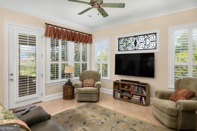 living room featuring ceiling fan, light tile patterned flooring, and ornamental molding