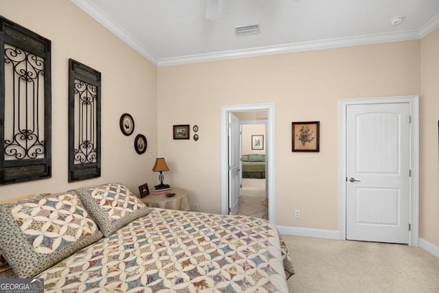 carpeted bedroom featuring ceiling fan and ornamental molding