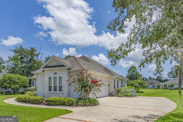 view of side of home with a garage and a yard