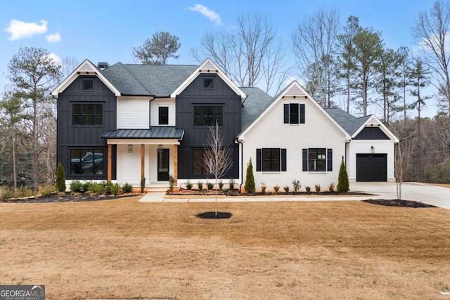 modern inspired farmhouse featuring a porch and a garage