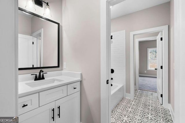 bathroom featuring vanity and  shower combination