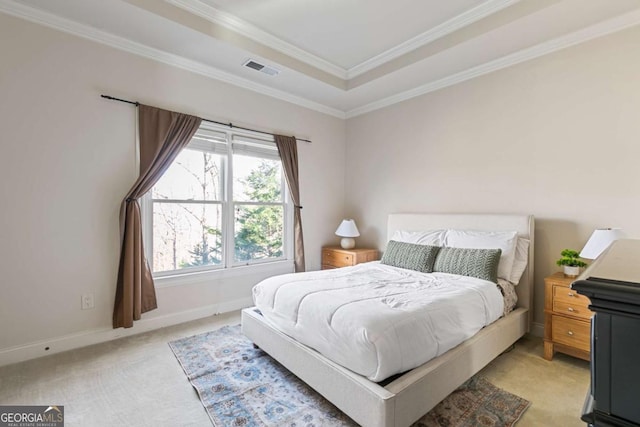 bedroom featuring a raised ceiling, crown molding, and light carpet