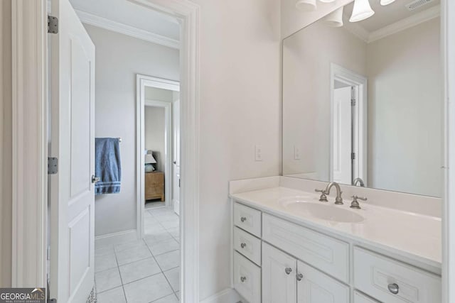 bathroom with tile patterned flooring, vanity, and crown molding