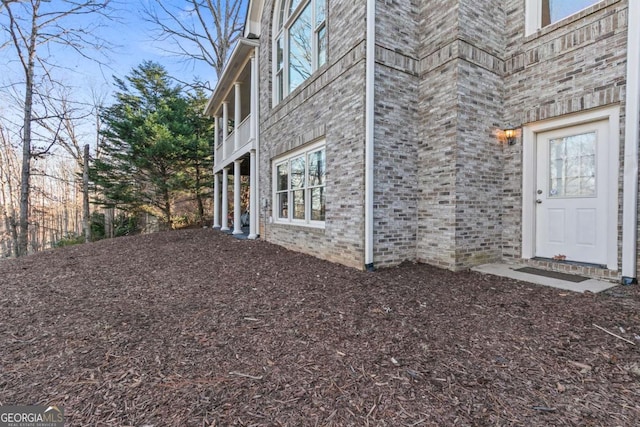 view of side of property with a balcony