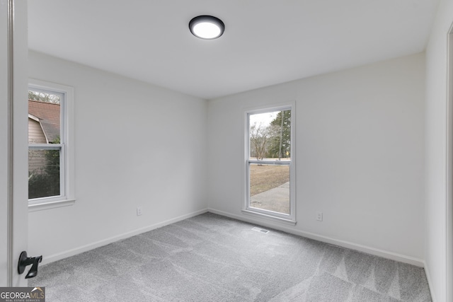 empty room featuring carpet floors