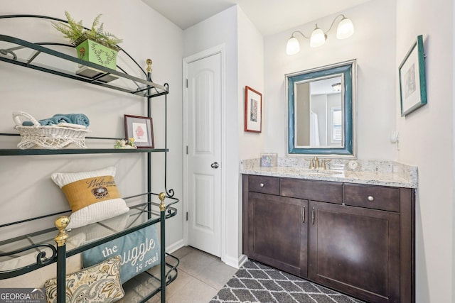 bathroom featuring tile patterned flooring and vanity