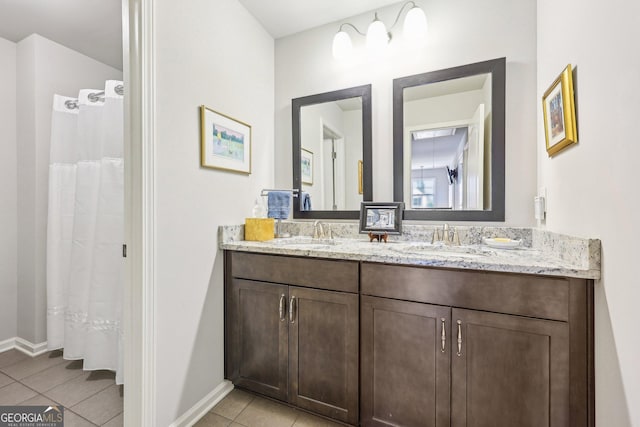 bathroom featuring tile patterned floors and vanity