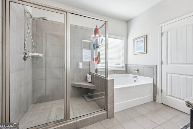 bathroom featuring shower with separate bathtub and tile patterned floors