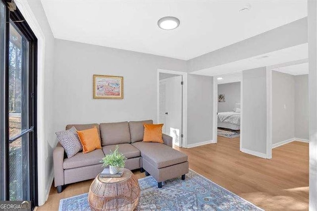 living room with light hardwood / wood-style floors