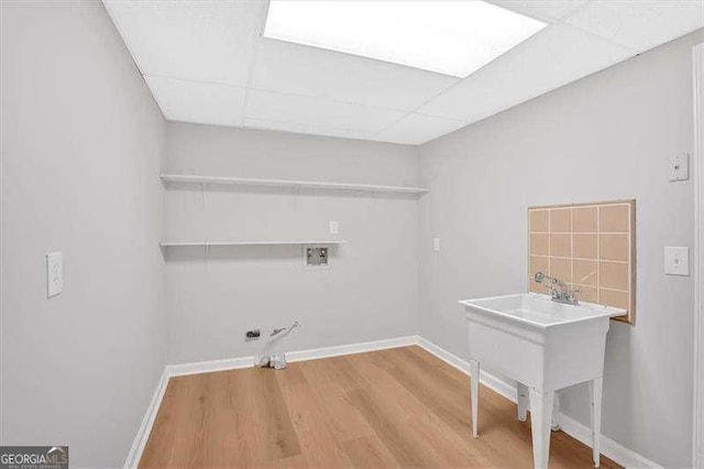 laundry room featuring hookup for a washing machine, hardwood / wood-style flooring, and gas dryer hookup