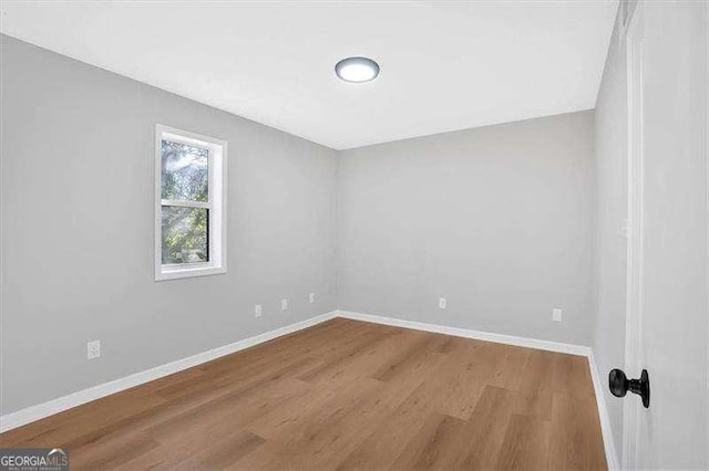 empty room featuring hardwood / wood-style floors