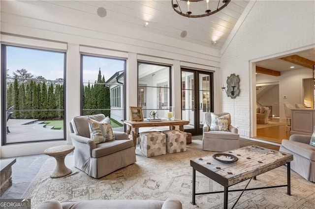 sunroom with a chandelier, lofted ceiling, and wood ceiling