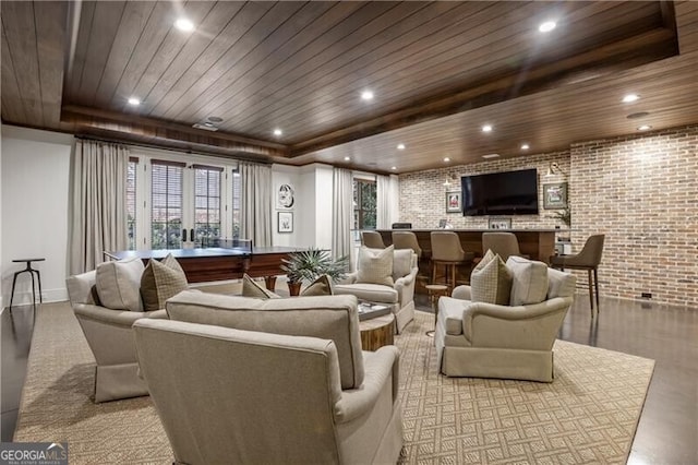 interior space with wooden ceiling, french doors, and brick wall