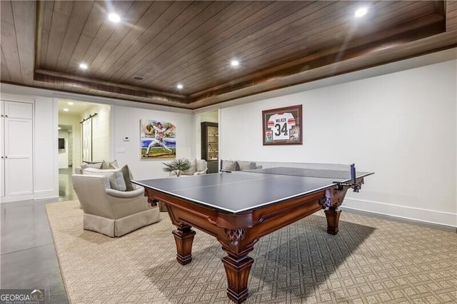 recreation room with a tray ceiling and wood ceiling