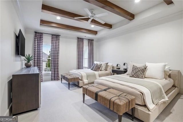 bedroom with ceiling fan, beamed ceiling, and light colored carpet